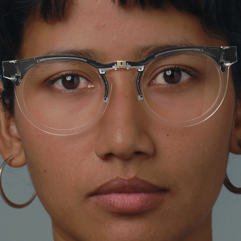 Person wearing clear-framed glasses