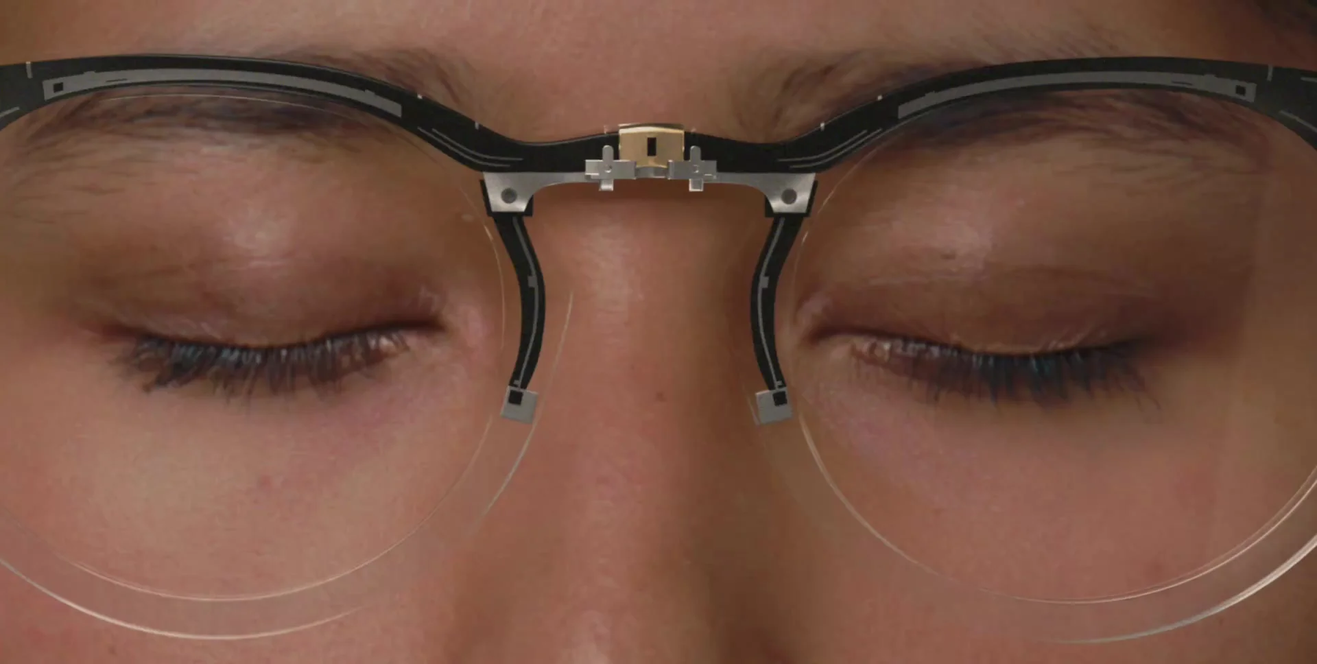 Close-up of a person with their eyes closed, wearing sensor-embedded eyewear
